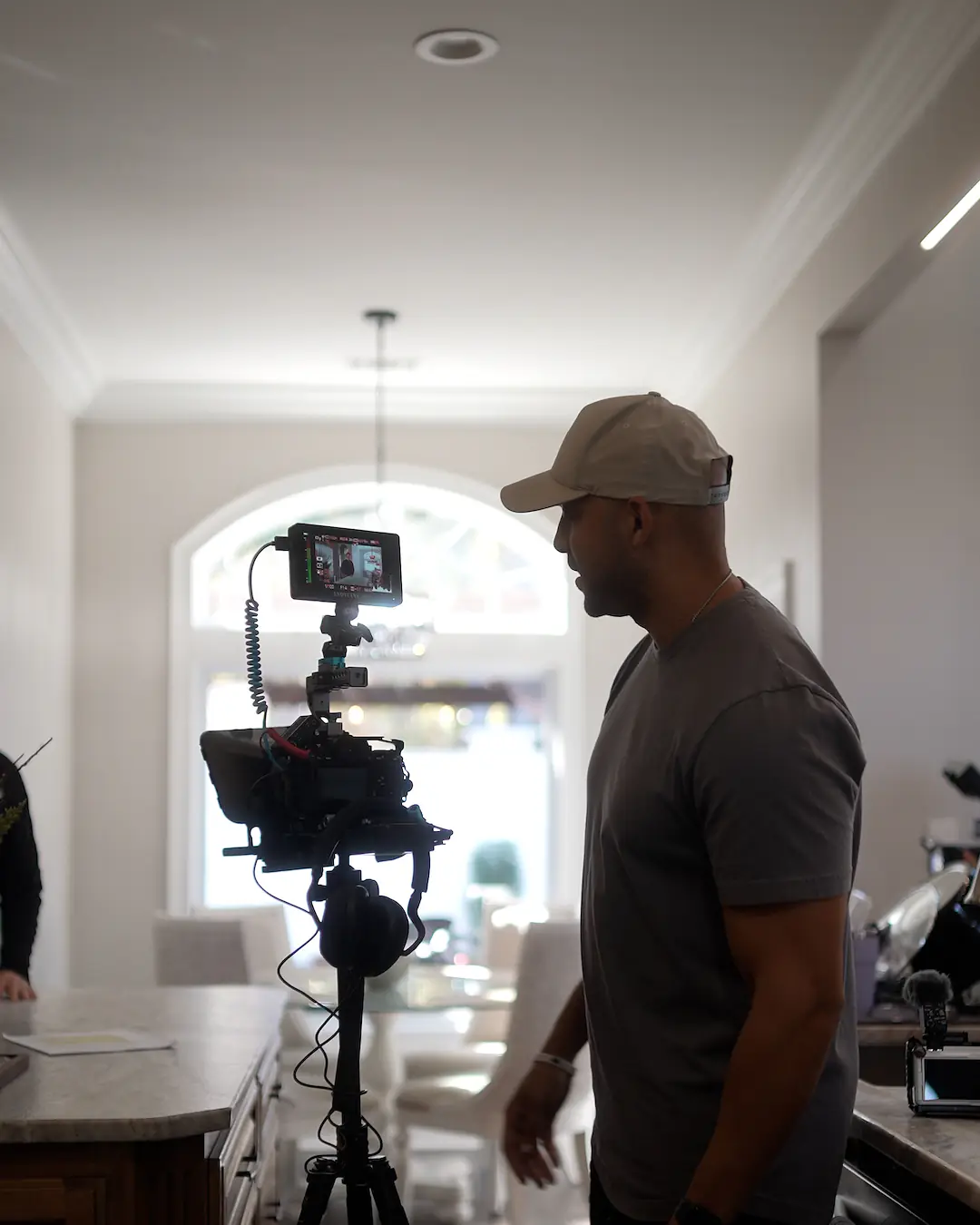 Chris on set behind a rigged cinema camera and field monitor